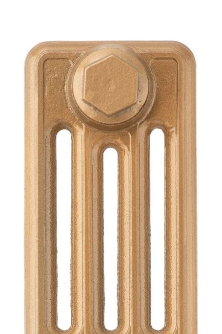 Close-up of a gold metallic object with a hexagonal nut and vertical slots.